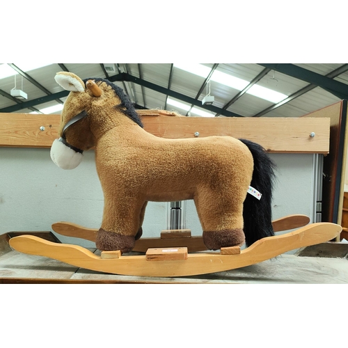22 - A child's plush rocking horse