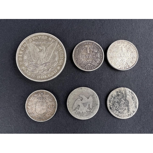 323 - WORLD COINAGE: An 1890 American Morgan dollar, New Orleans mint, 26gms; An 1876 German 1 Mark coin, ... 