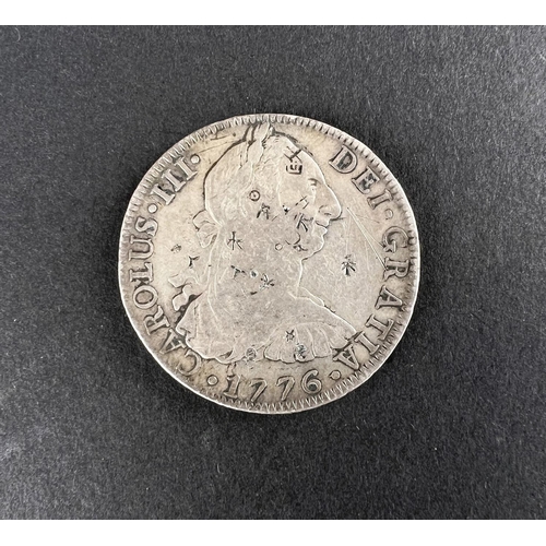 331 - WORLD COINAGE: A 1776 Mexico Spanish Colony Carlos III 8 Reals silver coin bearing chop/counter mark... 