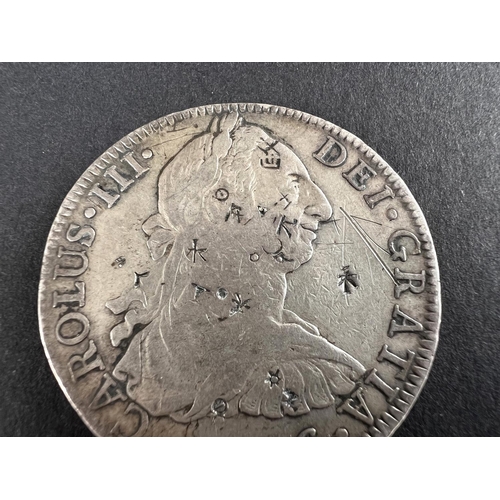 331 - WORLD COINAGE: A 1776 Mexico Spanish Colony Carlos III 8 Reals silver coin bearing chop/counter mark... 