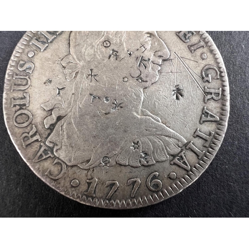 331 - WORLD COINAGE: A 1776 Mexico Spanish Colony Carlos III 8 Reals silver coin bearing chop/counter mark... 