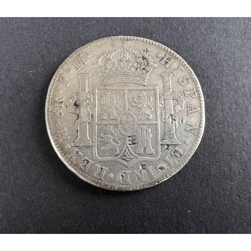 331 - WORLD COINAGE: A 1776 Mexico Spanish Colony Carlos III 8 Reals silver coin bearing chop/counter mark... 