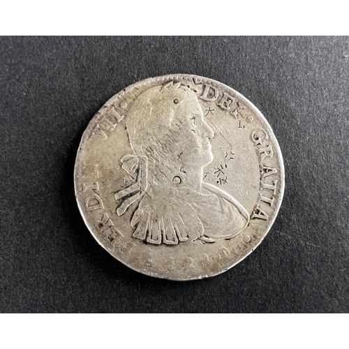 332 - WORLD COINAGE: An 1811 Mexico Ferdinand VII with portrait of Carlos IV 8 Reals silver coin with chop... 