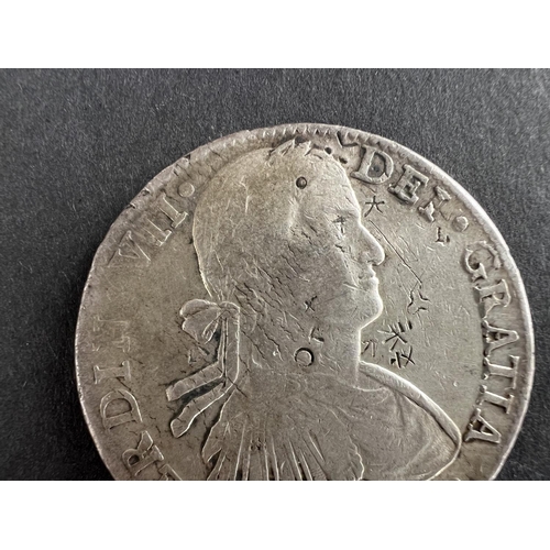 332 - WORLD COINAGE: An 1811 Mexico Ferdinand VII with portrait of Carlos IV 8 Reals silver coin with chop... 