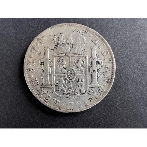 332 - WORLD COINAGE: An 1811 Mexico Ferdinand VII with portrait of Carlos IV 8 Reals silver coin with chop... 