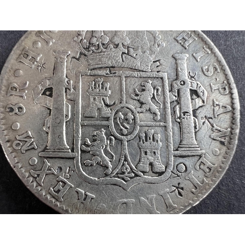 332 - WORLD COINAGE: An 1811 Mexico Ferdinand VII with portrait of Carlos IV 8 Reals silver coin with chop... 