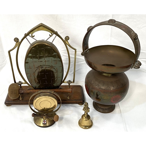 4 - An Arts and Crafts table gong, brass on a wooden base; a brass spittoon; other similar items.