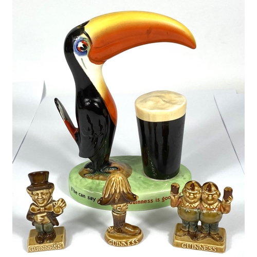 411 - A vintage Carlton Ware Guinness advertising toucan lamp (no fittings) and three smaller Guinness adv... 