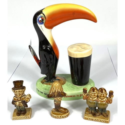 411 - A vintage Carlton Ware Guinness advertising toucan lamp (no fittings) and three smaller Guinness adv... 