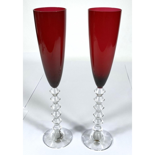 412 - BACCARAT: a set of of two Vega Flutissimo crystal champagne flutes, etched signature to bases, red a... 