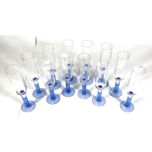 413 - IITTALA: a set of twelve Finnish glass Iittala Mondo champagne glasses with light blue stems