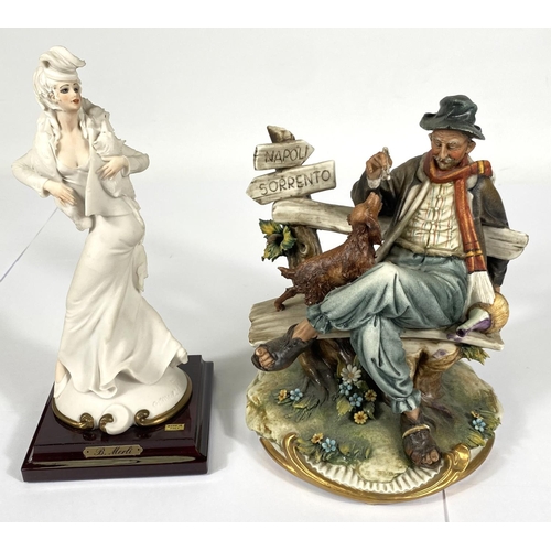 415 - A Capodimonte Principle fine porcelain figure of tramp on bench feeding a dog, ht. 20cm; a resin Cap... 