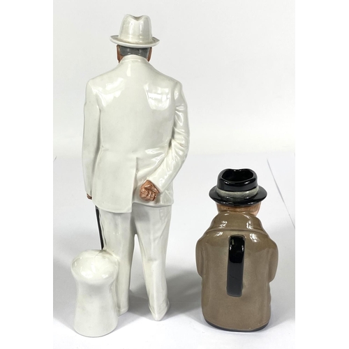 418 - A Royal Doulton figure Winston Churchill HN3057 (second); a Winston Churchill character jug (second)