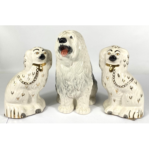 424 - A large Beswick figure of an Old English Sheepdog, (tongue slight chips) ht. 29cm, two Beswick Staff... 