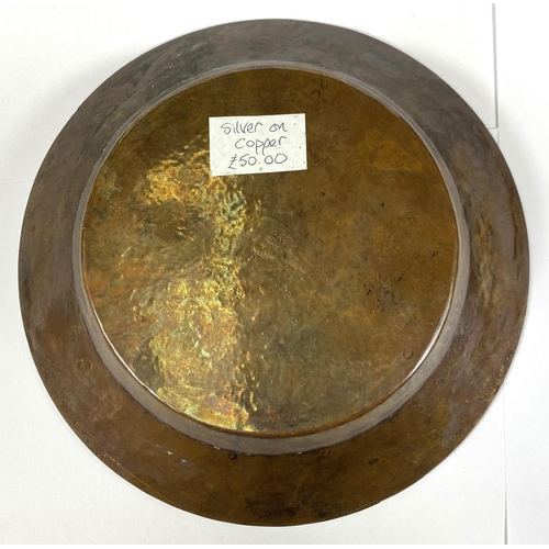 425 - A 19th century Middle Eastern copper dish overlaid with silver, 21cm: a white metal dish (tests as s... 