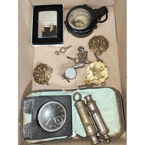 43 - WWII era - a prismatic marching compass; various whistles, cap badges, a services pocket watch etc