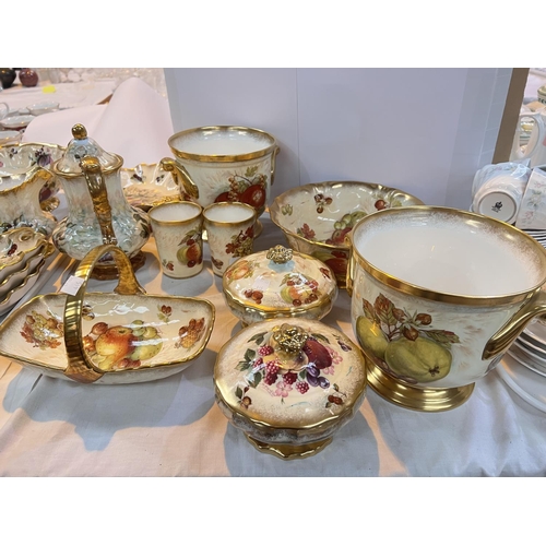 445 - A selection of Hammersley china and teaware decorated with fruit, some signed 