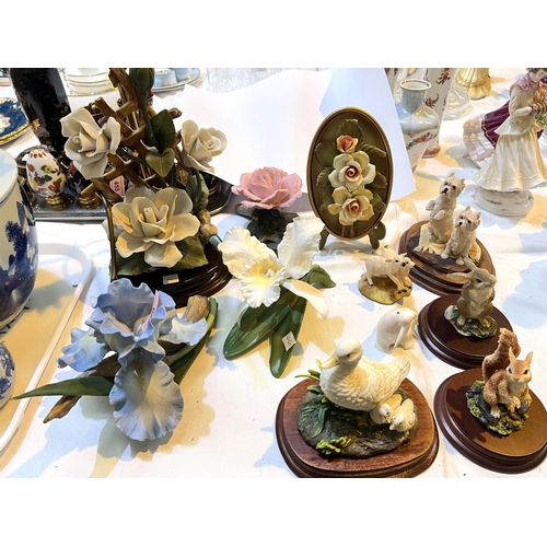 460 - A collection of bisque hand painted flower display, a similar lamp and a similar swan and animals&nb... 