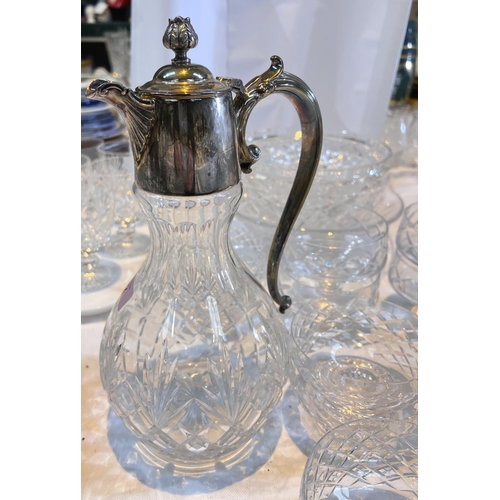 472 - A cut glass Claret jug with silver plated top, handle and a selection of cut glass bowls etc