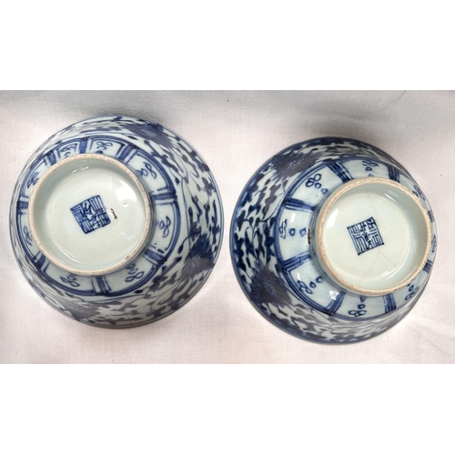 485 - A pair of Chinese 18th century blue and white bowls with scrolling floral underglaze designs, seal m... 