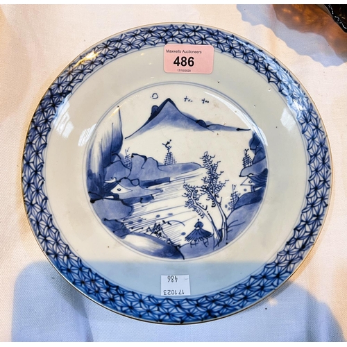 486 - A Chinese 18th century blue and white dish with mountainous central scene, brown rim with geometric ... 