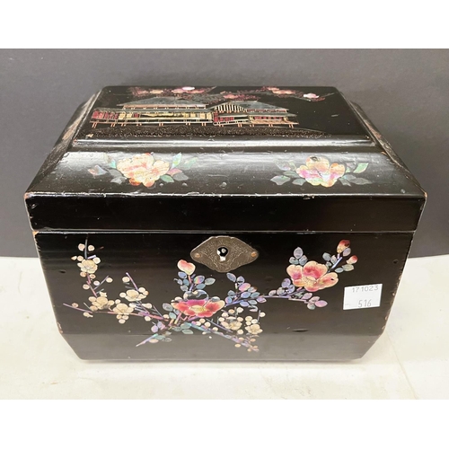 516 - A Japanese Meiji period lacquer tea caddy inlaid with mother of pearl, building to top and flowers a... 