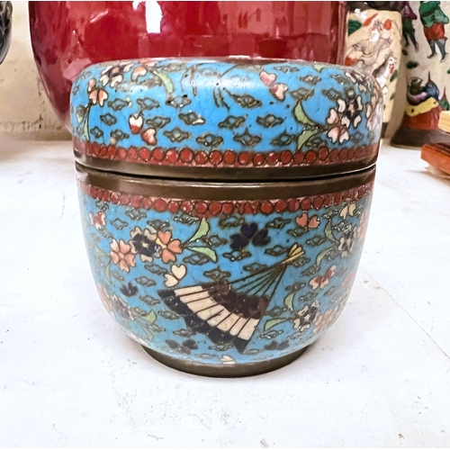 517 - A Chinese 19th century turquoise ground lidded circular pot with two cranes to the lid, fans and flo... 