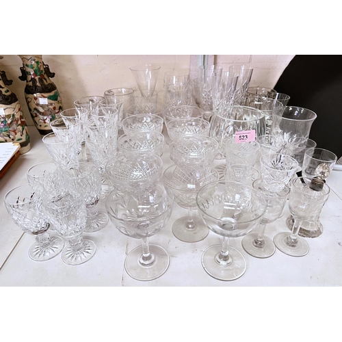 523 - A selection of cut glass coupe glasses other similar champagne flutes Stuart and other crystal inclu... 