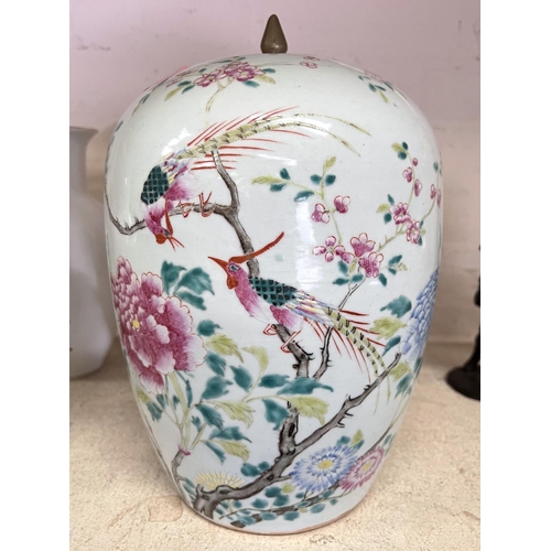 530 - A 19th century Chinese large covered jar decorated in the famille rose manner with birds on flowerin... 