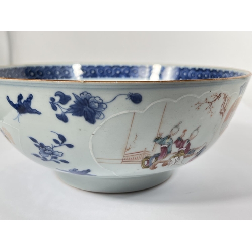 539 - An 18th century Chinese punch bowl with relief polychrome panels to the outside, border to the inter... 