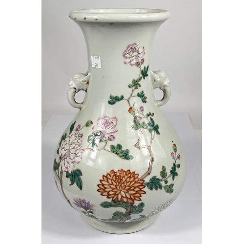 540 - A Chinese famille rose vase decorated with polychrome peacock and flowers, with elephant handles, ht... 