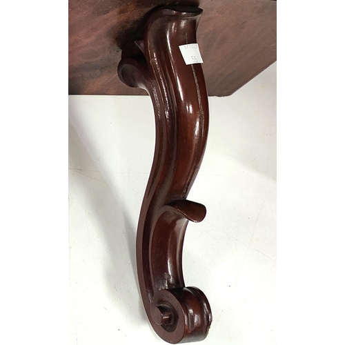 55 - A Regency mahogany clock bracket, and another