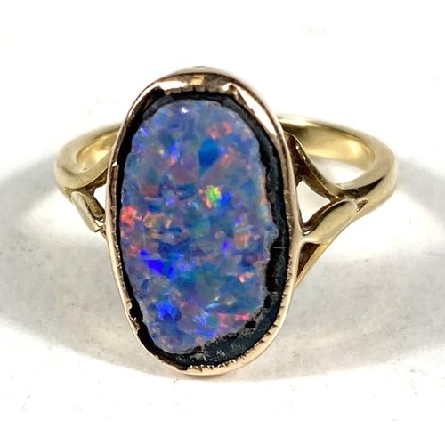 609 - An 18ct gold oval shaped black opal (14mm x 9mm) doublet ring, 3.37gms, ring size K/L.