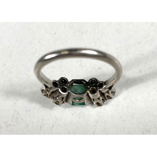 611 - A platinum stamped Art Deco dress ring, square cut emerald approximately 6mm x 6mm with bevelled and... 