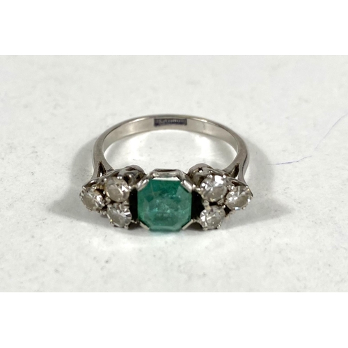 611 - A platinum stamped Art Deco dress ring, square cut emerald approximately 6mm x 6mm with bevelled and... 