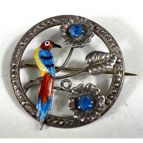 613 - A sterling silver brooch with enamelled bird in flowers, set 2 blue tones; a white metal brooch stam... 