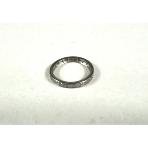 618 - A platinum eternity ring set 22 diamond chips (1 stone missing), size M/N, 3.2gm