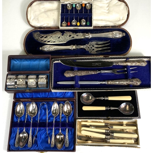 621 - A silver handled boxed carving set, four cased silver plated buckle napkin rings; a cased set of hal... 