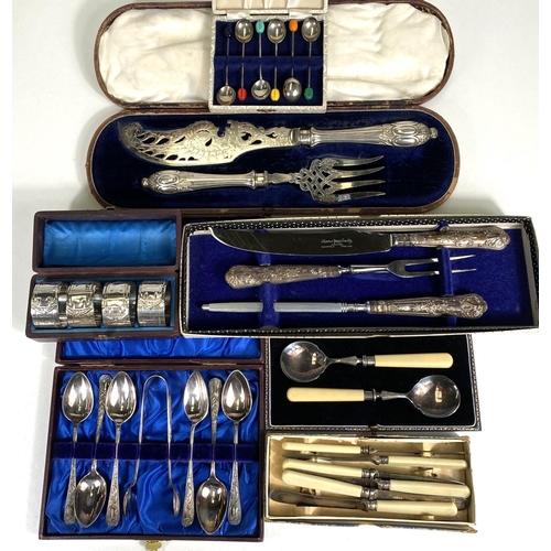 621 - A silver handled boxed carving set, four cased silver plated buckle napkin rings; a cased set of hal... 