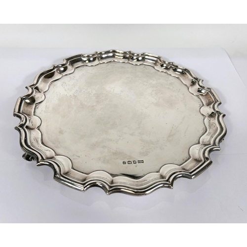 628 - A Georgian style hallmarked silver salver with wavy rim, Sheffield 1967, 19oz, dia. 26cm