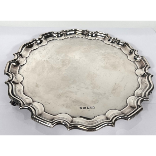 628 - A Georgian style hallmarked silver salver with wavy rim, Sheffield 1967, 19oz, dia. 26cm