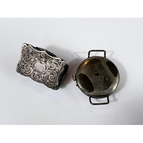 630 - A hallmarked silver Victorian vinaigrette (internals missing), scrolling decoration to outside, Birm... 