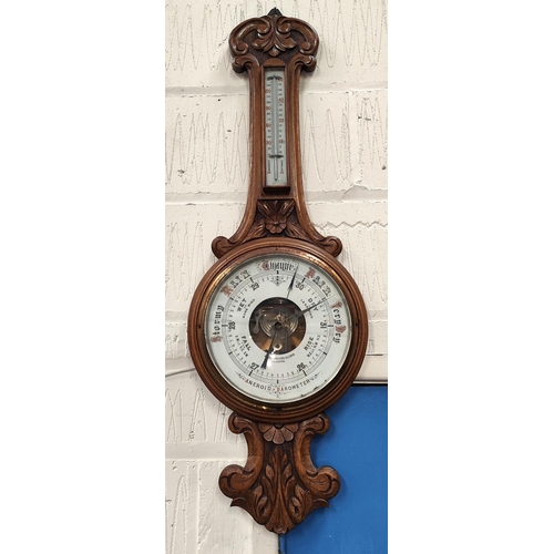 64 - A Shearwater Lloyd of Liverpool Oak cased aneroid barometer carved case with open workings &nbs... 