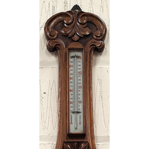 64 - A Shearwater Lloyd of Liverpool Oak cased aneroid barometer carved case with open workings &nbs... 