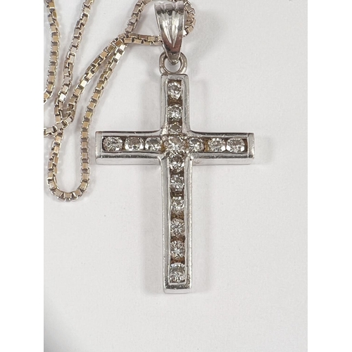 654 - Unmarked metal cross set with 16 diamonds on 18ct white gold, square link chain 7.2gm (cross tests a... 