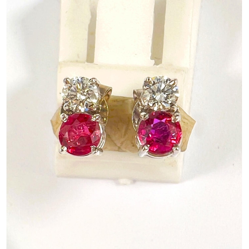 659 - A pair of 18ct white gold diamond and ruby set earrings. Diamond 4mm diameter. Ruby 4.5mm diameter. ... 