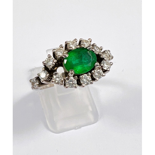 663 - An Art Deco style 18ct white metal dress ring set with large central emerald. 8 x 6mm approx surroun... 