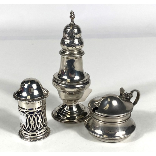 666 - A Georgian silver baluster shaped spice shaker, Maker GS, London 1780, silver mustard pot and a silv... 