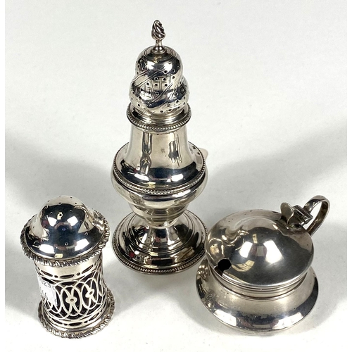 666 - A Georgian silver baluster shaped spice shaker, Maker GS, London 1780, silver mustard pot and a silv... 