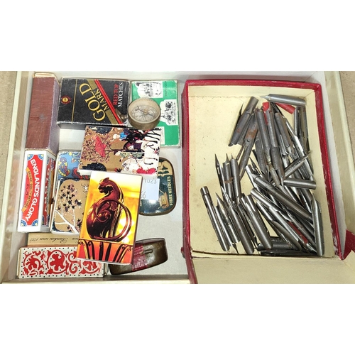 67 - A box of collectables:  dip pen nibs; windup gramophone needles; vintage matchboxes; etc.